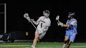 Connor Ganschow brings the ball up the field against Nazareth